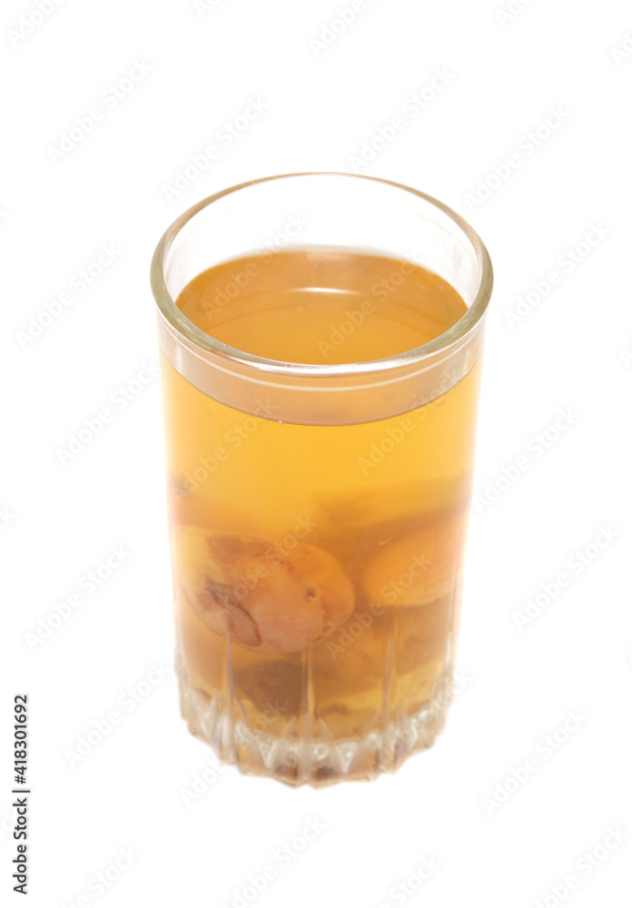 a glass of compote with fruit on a white background a glass of compote with fruit on a white background