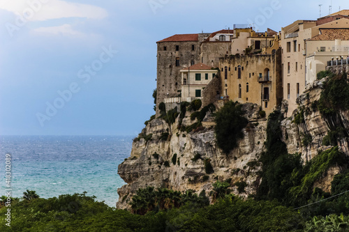 stone house on a clipp in tropea calabria in front of the ocean