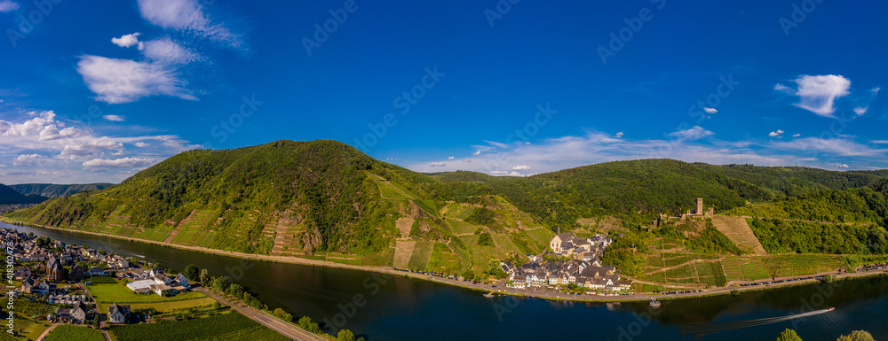 Panoramic view of the Moselle vineyards near Beilstein, Germany. Metternich Castle above the Moselle river. .Drone photography.