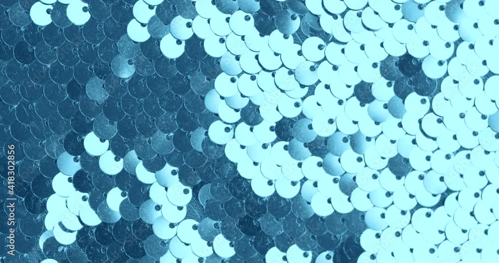 Background of blue sequins sparkling light play