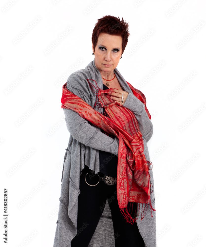 Mature woman with red hair and blue eyes on white endless background Mature woman with red hair and blue eyes on white endless background