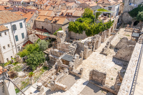 Empty limestone ruin construction in middle of old town Dubrovnik in Croatia summer photo