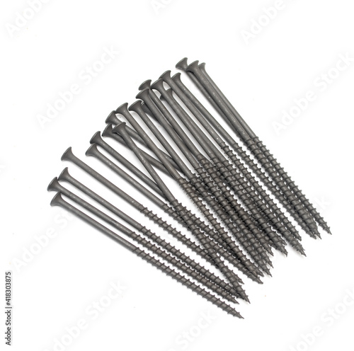 metal screws with long dark thread on white background