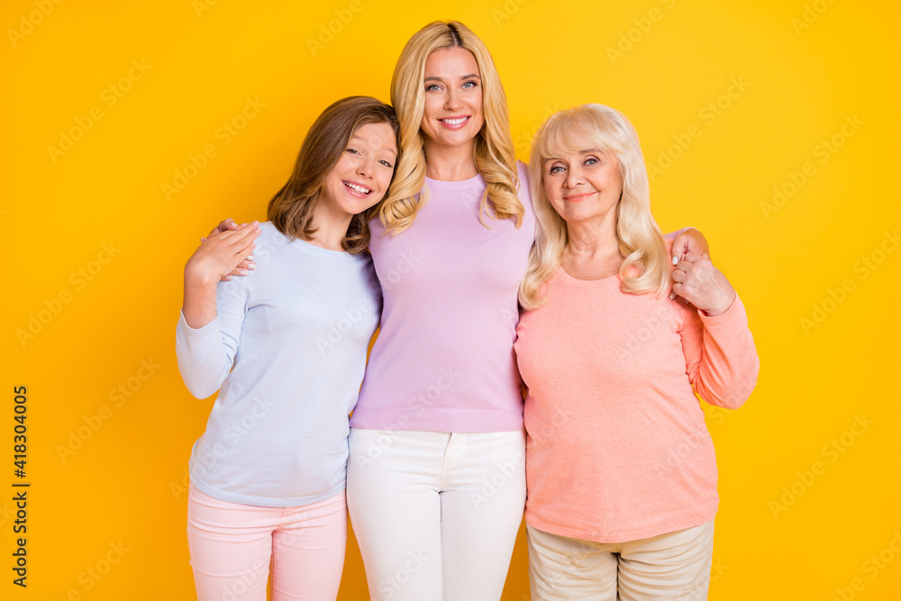 Obraz premium Photo of charming happy three family women good mood smile care isolated on shine yellow color background
