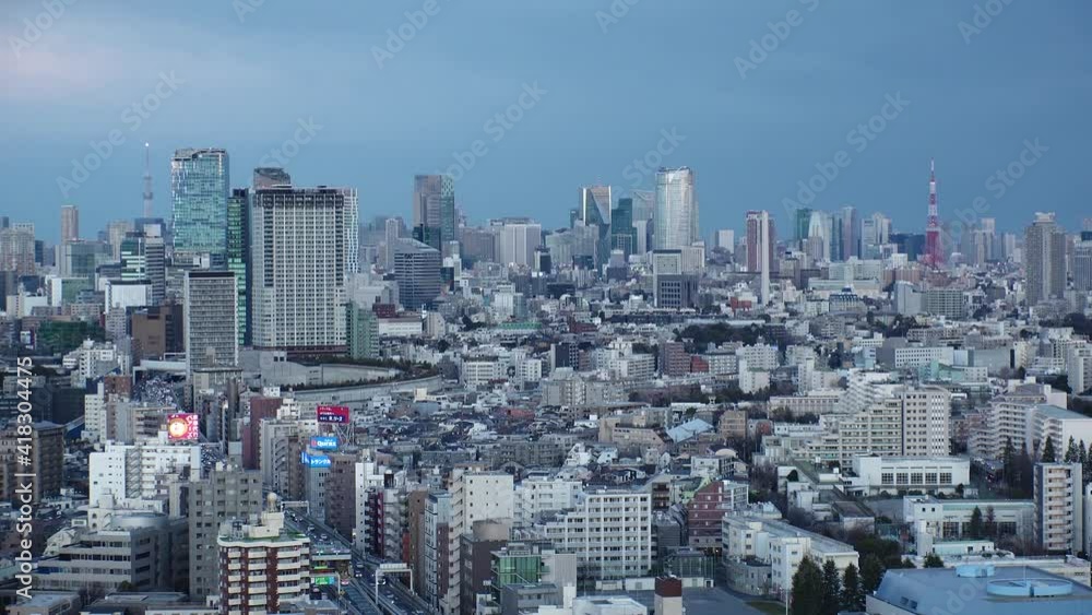 TOKYO, JAPAN : Aerial high angle sunset CITYSCAPE of TOKYO. View of buildings and streets at central downtown area. Japanese urban city life and metropolis concept. Long time lapse shot dusk to night. TOKYO, JAPAN : Aerial high angle sunset CITYSCAPE of TOKYO. View of buildings and streets at central downtown area. Japanese urban city life and metropolis concept. Long time lapse shot dusk to night.