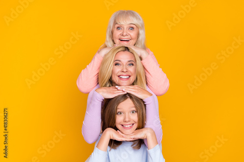 Slika na platnu Photo of nice optimistic three woman grand mom daughter hands face wear pastel c