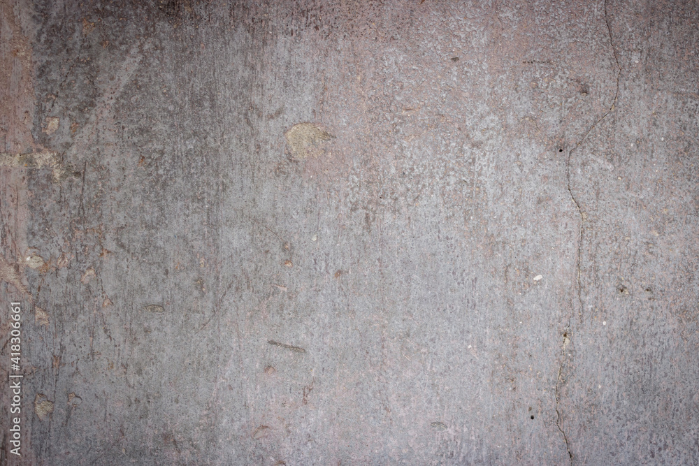 The texture of the old concrete wall for the background. Dark background, empty background. Close up photography.