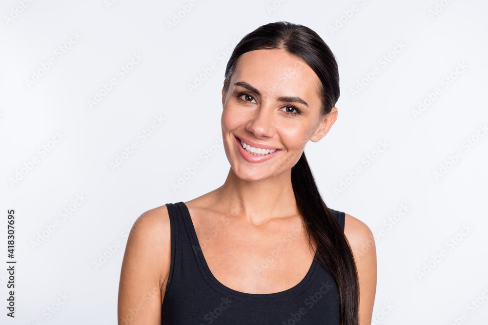 Photo of happy smiling good mood beautiful charming sporty girl fitness trainer wear singlet isolated on white color background Photo of happy smiling good mood beautiful charming sporty girl fitness trainer wear singlet isolated on white color background