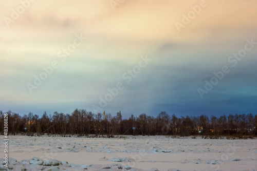 sunset over the river in winter in Omsk