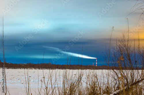 sunset over the river in winter in Omsk