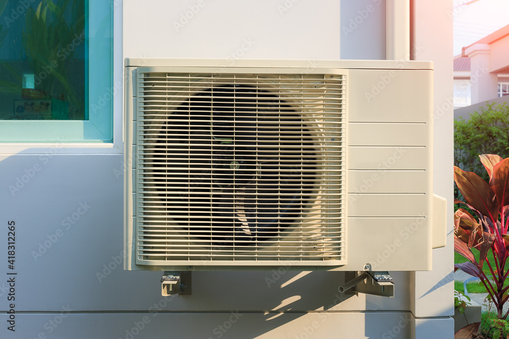 Condenser unit or compressor outside home or residential building. Unit of  central air conditioner (AC) or heating ventilation air conditioning system  (HVAC). Electric fan and refrigerant pump inside. Stock Photo | Adobe