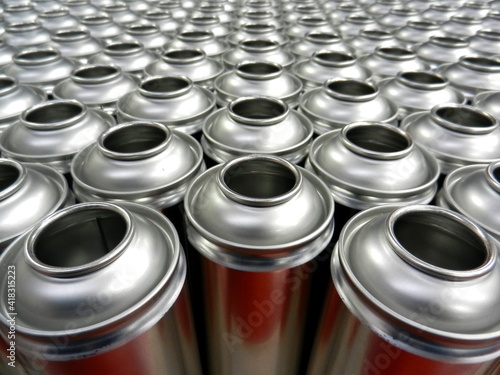 Aerosol cans awaiting production filling process in factory
