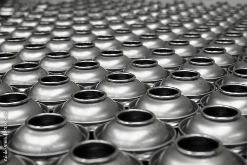 Aerosol cans awaiting production filling process in factory