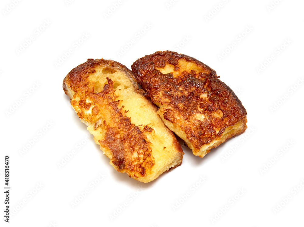 bread soaked in egg croutons on a white plate, fried bread soaked in egg croutons on a white plate, fried