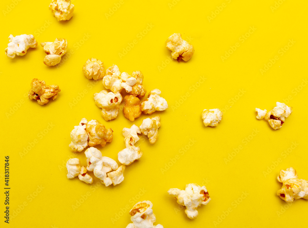 Close-up of popcorn on a yellow background. Close-up of popcorn on a yellow background.