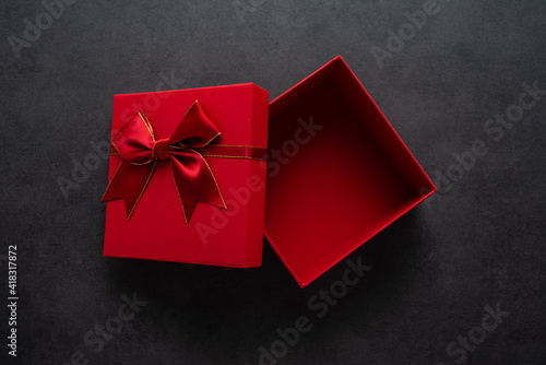 An empty gift box on a black background