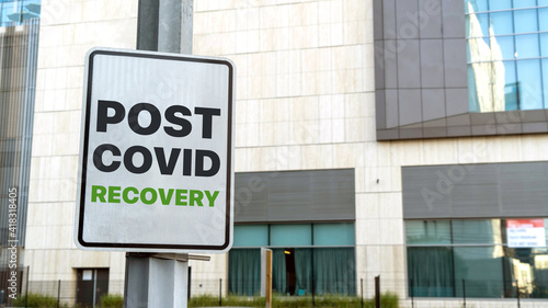 Post covid recover sign in a downtown city setting