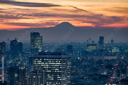 Tokyo skyline at sunset with view of Mount Fuji in the background