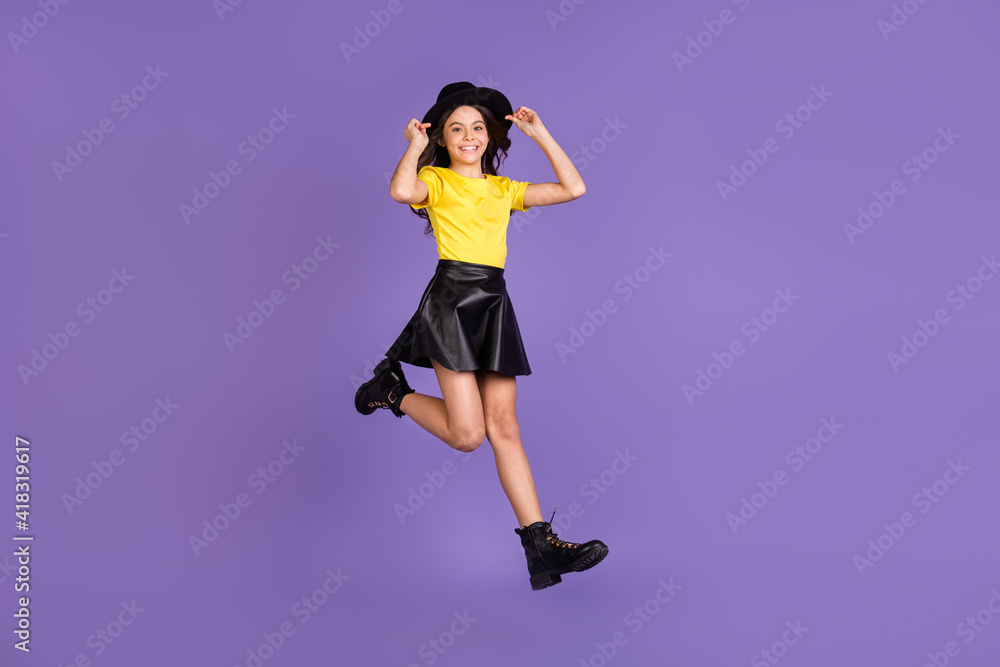 Full size profile photo of nice optimistic brunette hairdo girl jump dance wear cap t-shirt skirt shoes isolated on lilac background