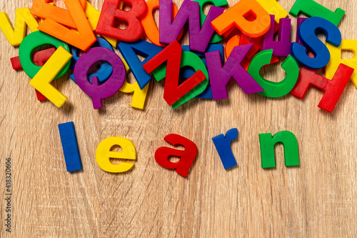 Colorful plastic alphabet and word "LEARN"