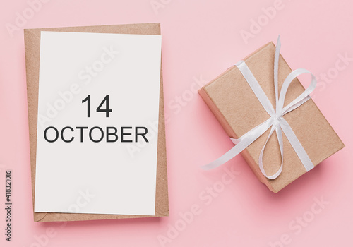 Gifts with note letter on isolated pink background, love and valentine concept with text 14 October