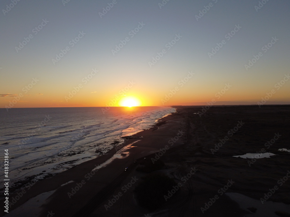 dunes in monte hermoso atlantic coast of Argentina, golden sand, photos with drone, sunset over sea