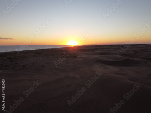 dunes in monte hermoso atlantic coast of Argentina  golden sand  photos with drone  sunset over sea