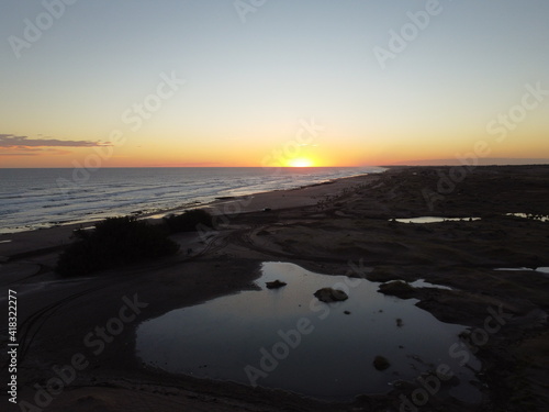 dunes in monte hermoso atlantic coast of Argentina  golden sand  photos with drone  sunset over sea