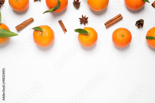 Christmas composition with tangerines on white background, flat lay. Space for text