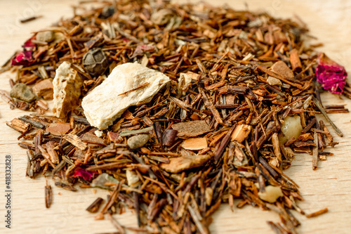 Dry rooibos healthy traditional organic tea with citrus and spices. Macro close-up. High quality photo