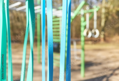 Close up picture of resistance bands at outdoor gym  selective focus.