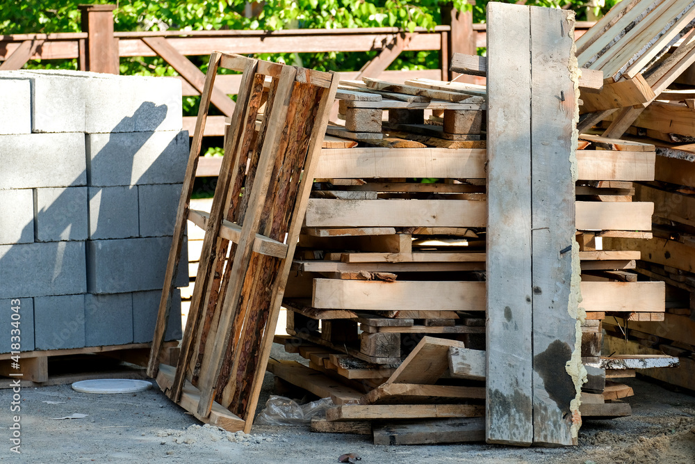 Wooden pallets and stands are lying on the road Wooden pallets and stands are lying on the road