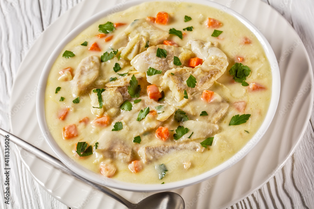 poached cod fish in milk base sauce poached cod fish in milk base sauce