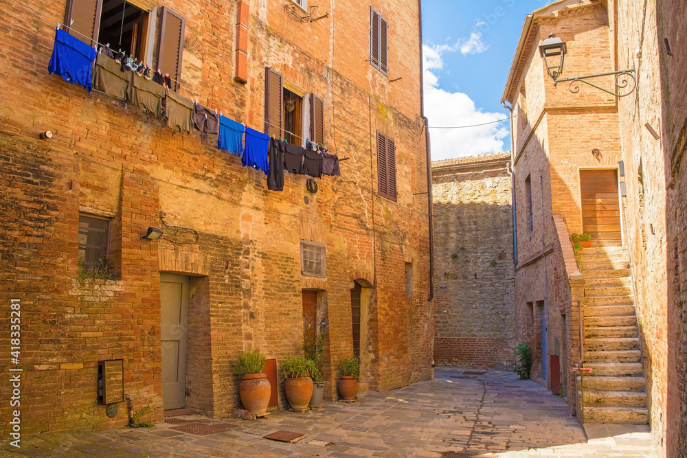Residential buildings in the historic medieval village of Buonconvento, Siena Province, Tuscany, Italy
