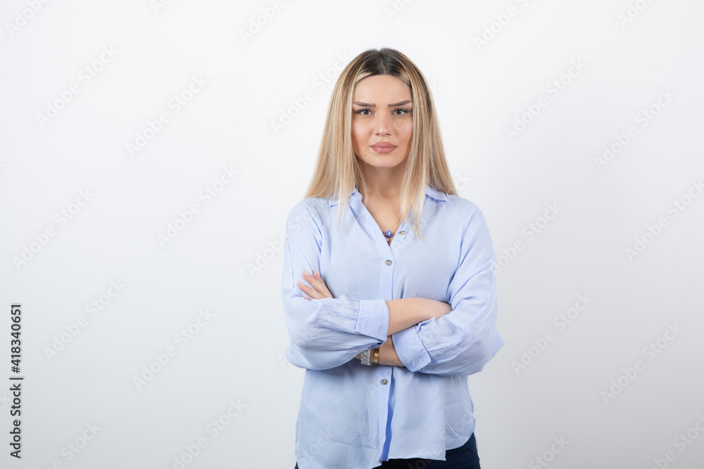 Young woman in casual outfit looking at camera on white background Young woman in casual outfit looking at camera on white background