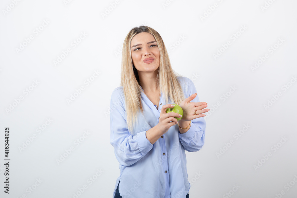 Portrait photo of a pretty attractive woman model standing and holding Portrait photo of a pretty attractive woman model standing and holding