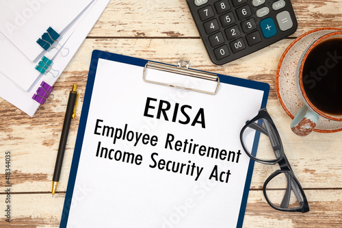 Paper with ERISA - Employee Retirement Income Security Act on the table photo