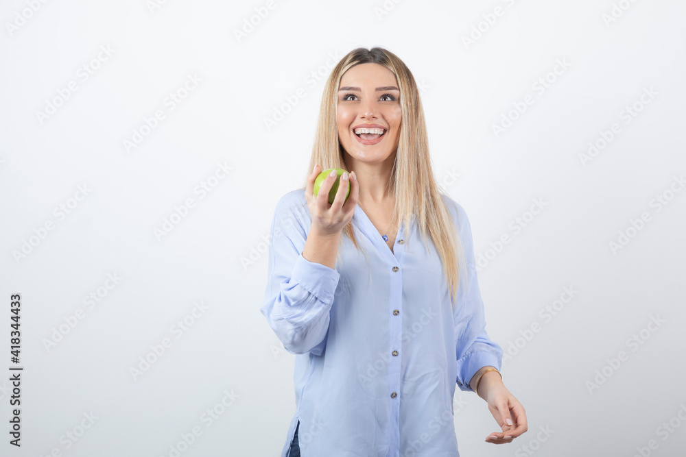 Portrait photo of a pretty attractive woman model standing and holding Portrait photo of a pretty attractive woman model standing and holding
