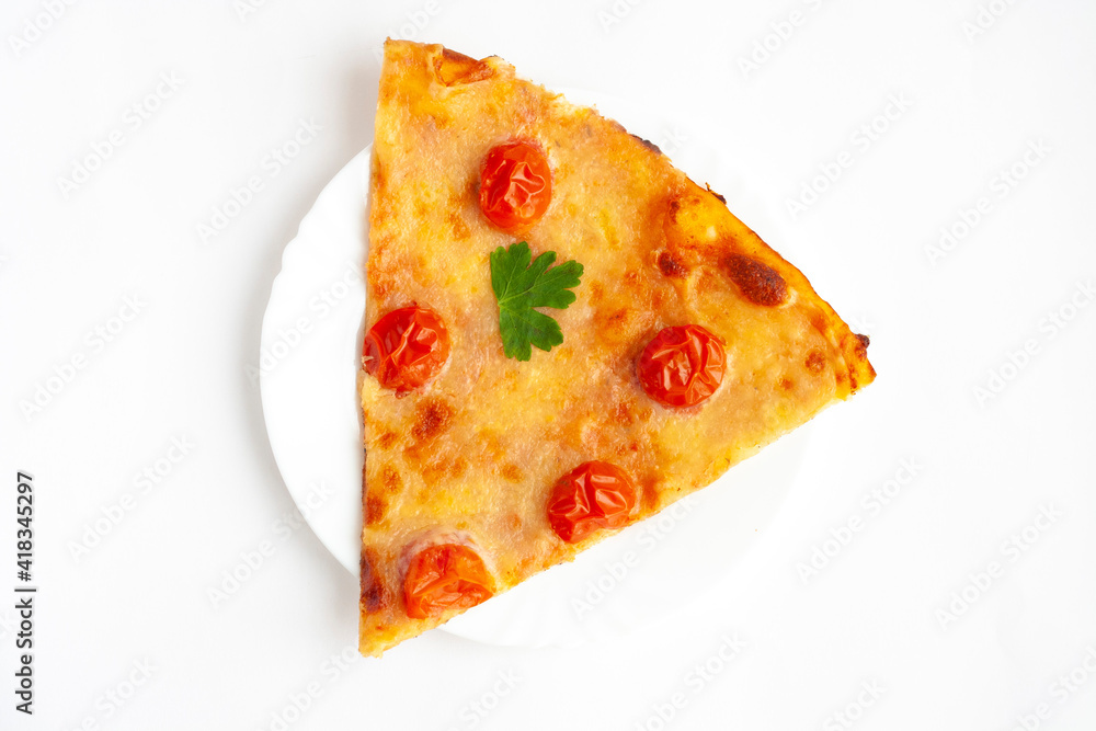 A slice of pizza margarita with cherry tomatoes on a white plate on a white background, top view A slice of pizza margarita with cherry tomatoes on a white plate on a white background, top view