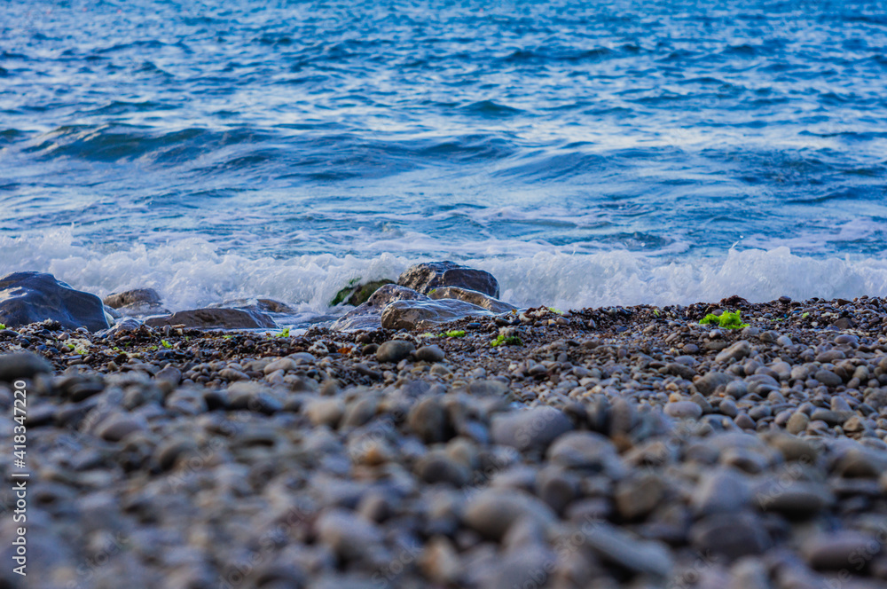 Obraz premium Small waves closeup on a dawn, seascape