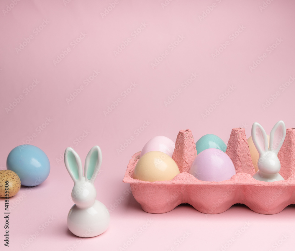 Easter colorful photografie with eggs group and bunny egg on pink background, copy space Easter colorful photografie with eggs group and bunny egg on pink background, copy space