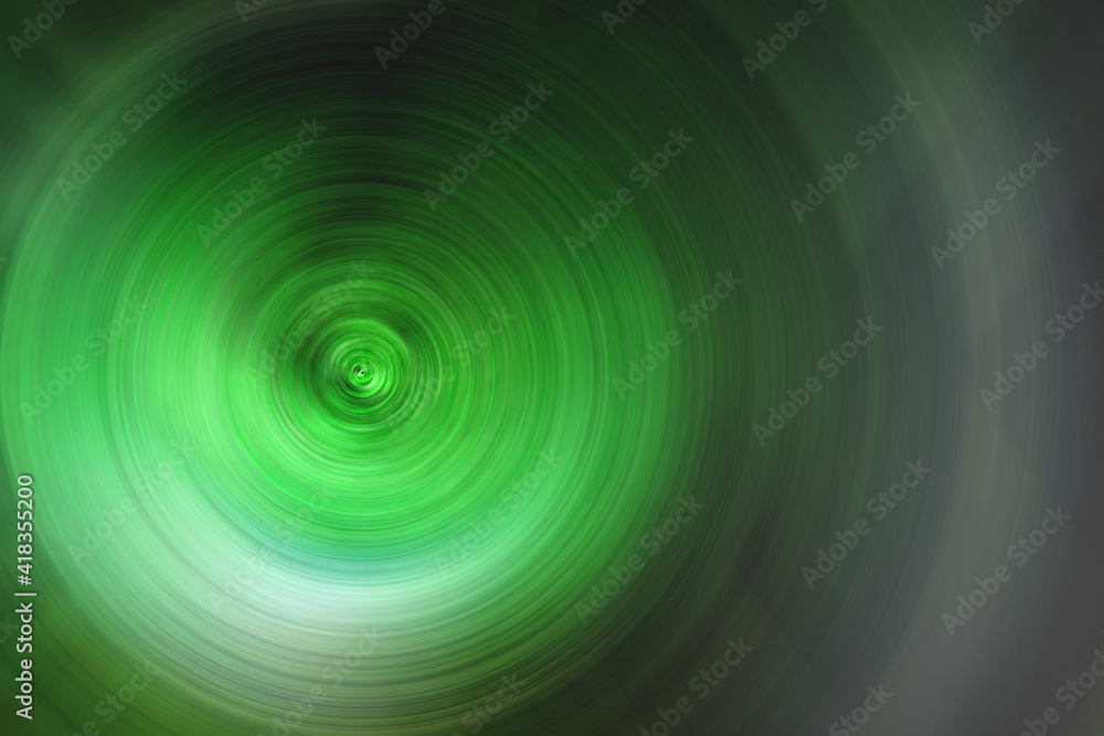 Abstract blured green background radial shape. Descending pattern. Scintillating circles colored texture Abstract blured green background radial shape. Descending pattern. Scintillating circles colored texture