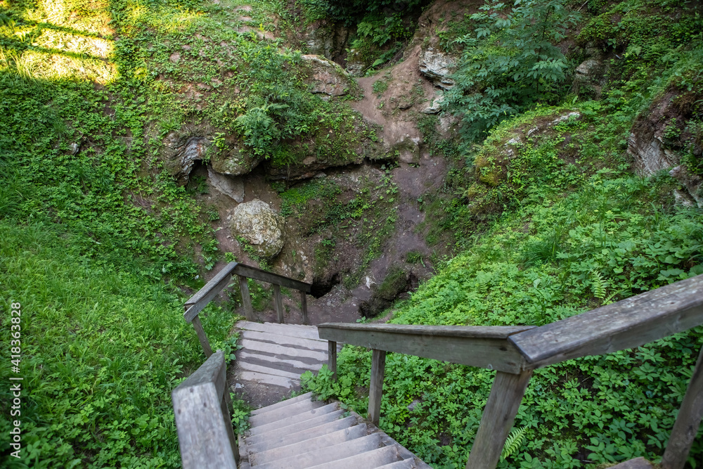 Karves ola (Cow's Cave), karst sinkhole in Birzai, Lithuania Karves ola (Cow's Cave), karst sinkhole in Birzai, Lithuania
