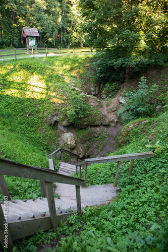 Karves ola (Cow's Cave), karst sinkhole in Birzai, Lithuania photo