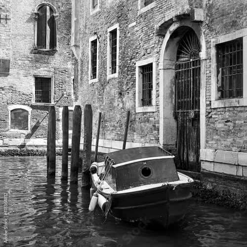 Картината върху платно Venetian side canal with old boat