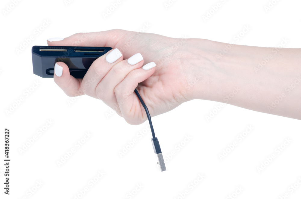 USB card reader in hand on a white background isolation USB card reader in hand on a white background isolation