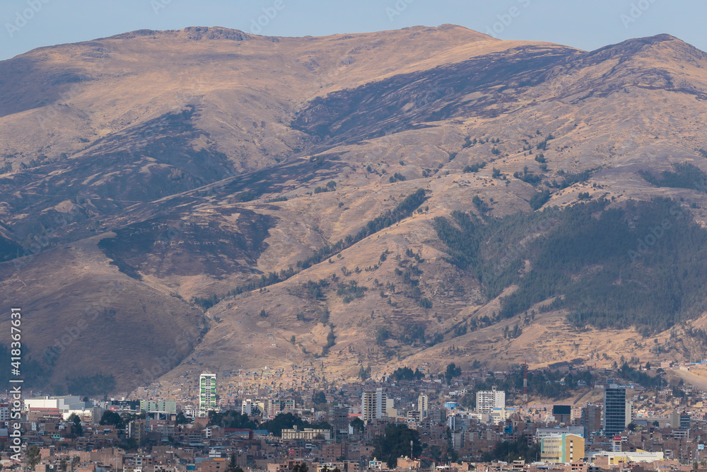 Panoramic view of the city of Huancayo at the foot of the imposing mountains and the snowy Huaytapallana. Huancayo - Peru