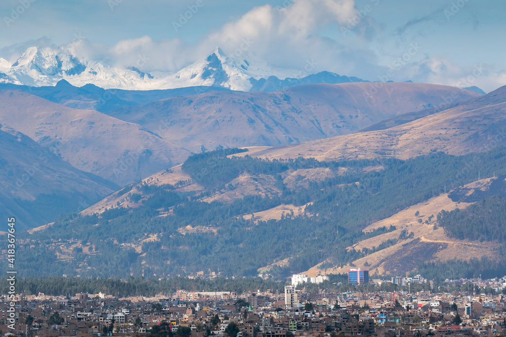 Panoramic view of the city of Huancayo at the foot of the imposing mountains and the snowy Huaytapallana. Huancayo - Peru