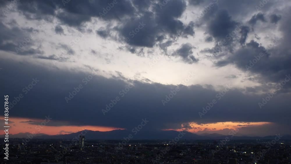 TOKYO, JAPAN : Aerial high angle sunset CITYSCAPE of TOKYO. View of huge dramatic clouds, buildings and streets. Japanese urban city life and metropolis concept. Long time lapse shot dusk to night. TOKYO, JAPAN : Aerial high angle sunset CITYSCAPE of TOKYO. View of huge dramatic clouds, buildings and streets. Japanese urban city life and metropolis concept. Long time lapse shot dusk to night.