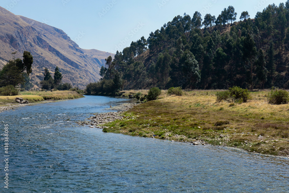 Tranquil scene of an Andean landscape next to the river nestled in the interior of the high mountains. Huancayo - Peru
